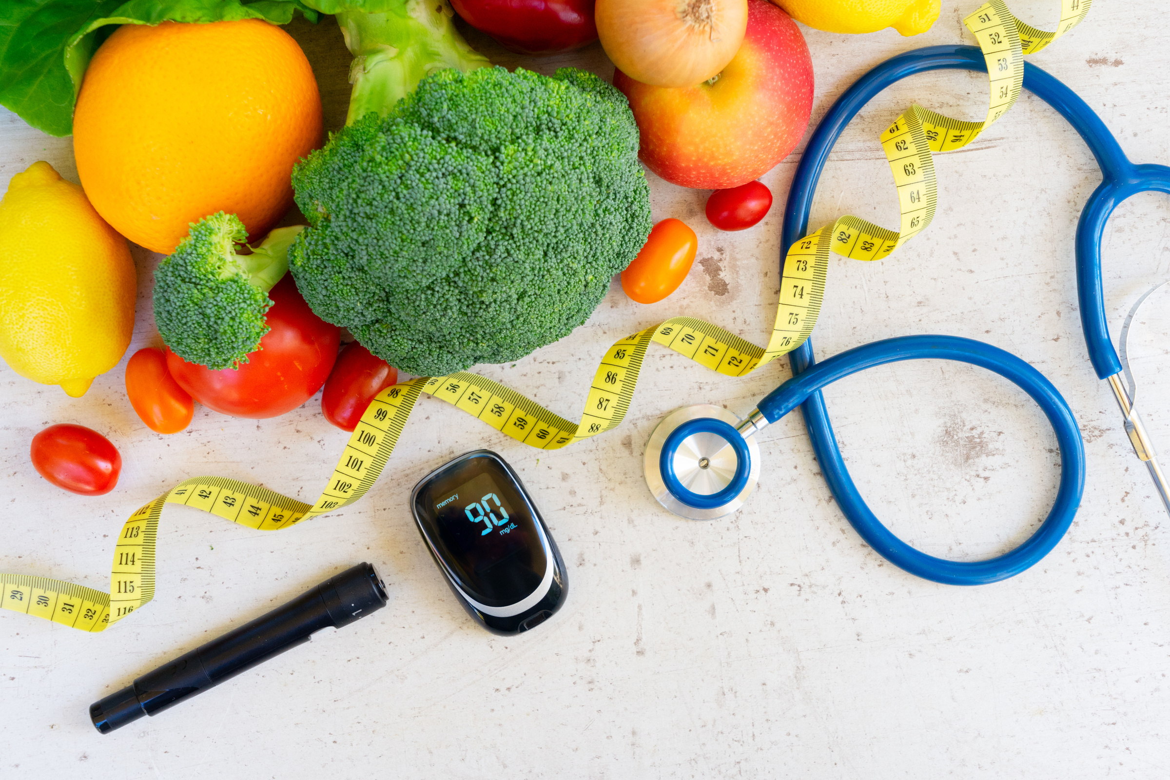 an assortment of fruits and vegetables with a stethoscope