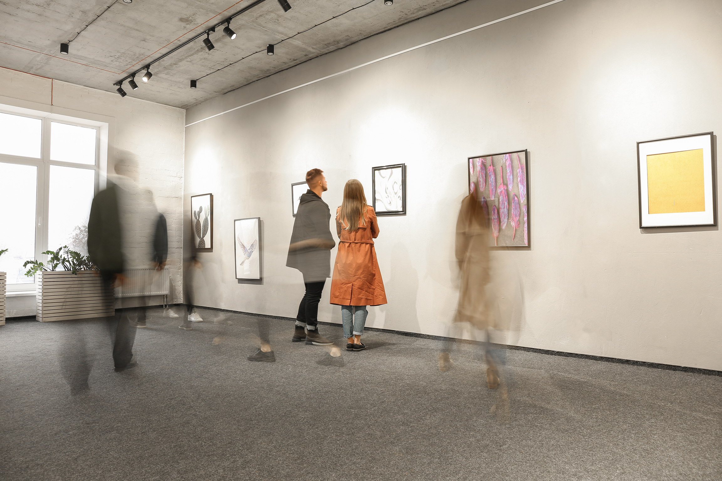 people looking at art in an art gallery