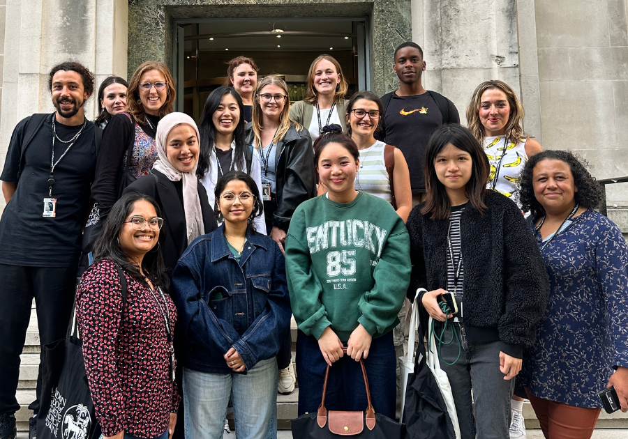 a group of Rotary Global Grant scholars posing for a photo in front of a building