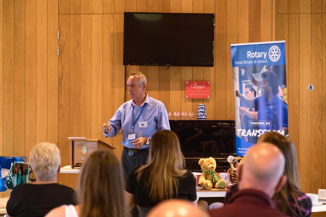 Robert Lovick giving a presentation to a group of people.