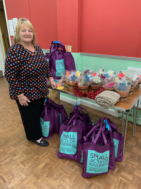 a person standing in front of a table full of toys