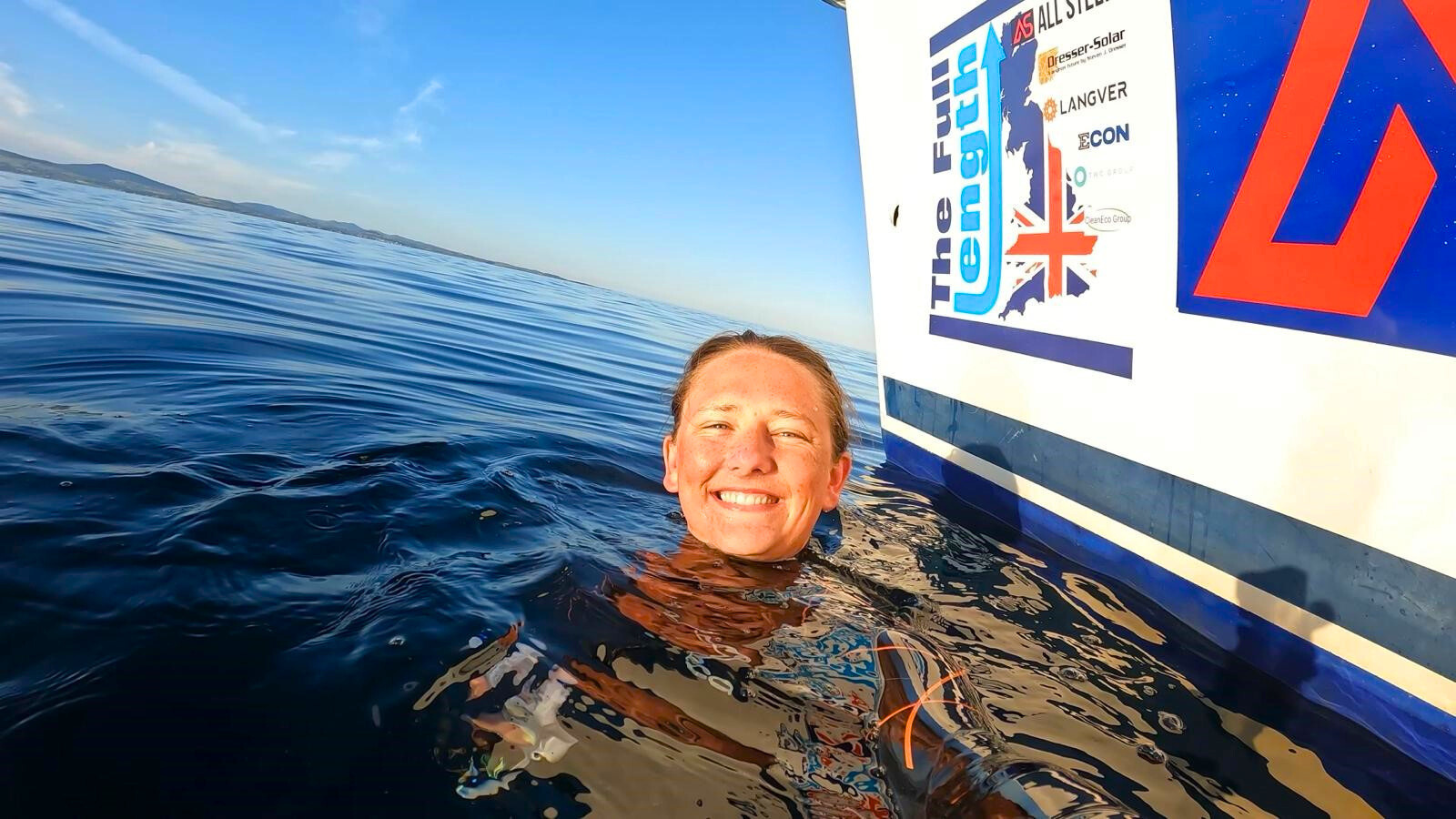 a person in the water smiling for the camera