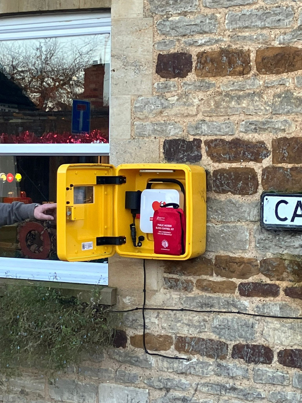 A bleed kit inside a public defibrillator box being displayed.