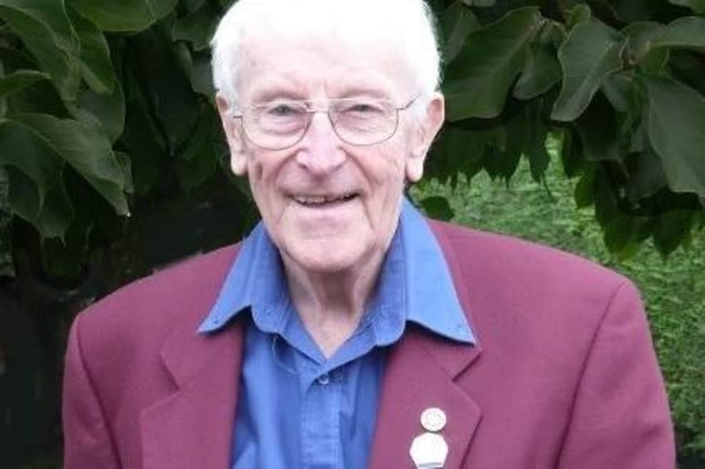 Paul Denton in a maroon jacket and blue shirt.