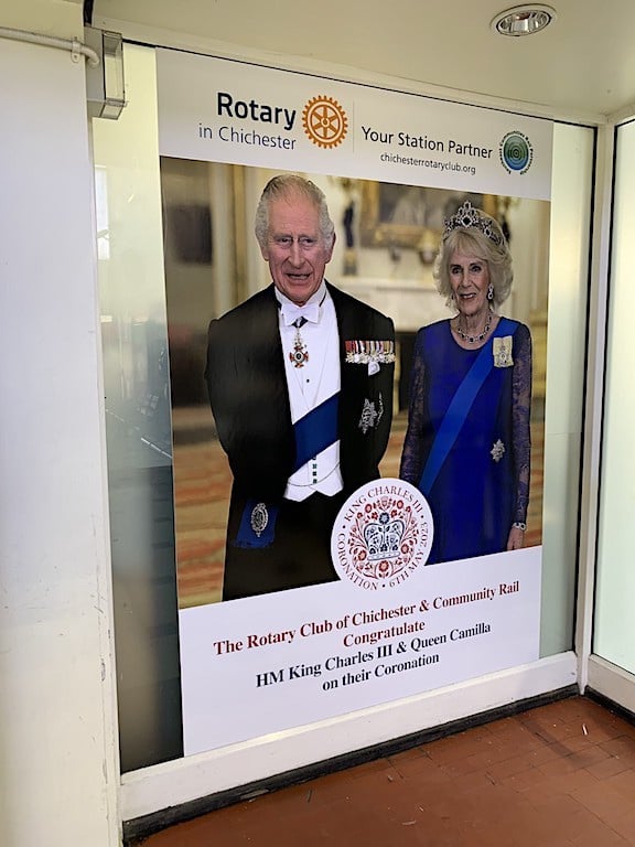 A poster of King Charles III and Queen Camilla with the Rotary in Chichester logo.