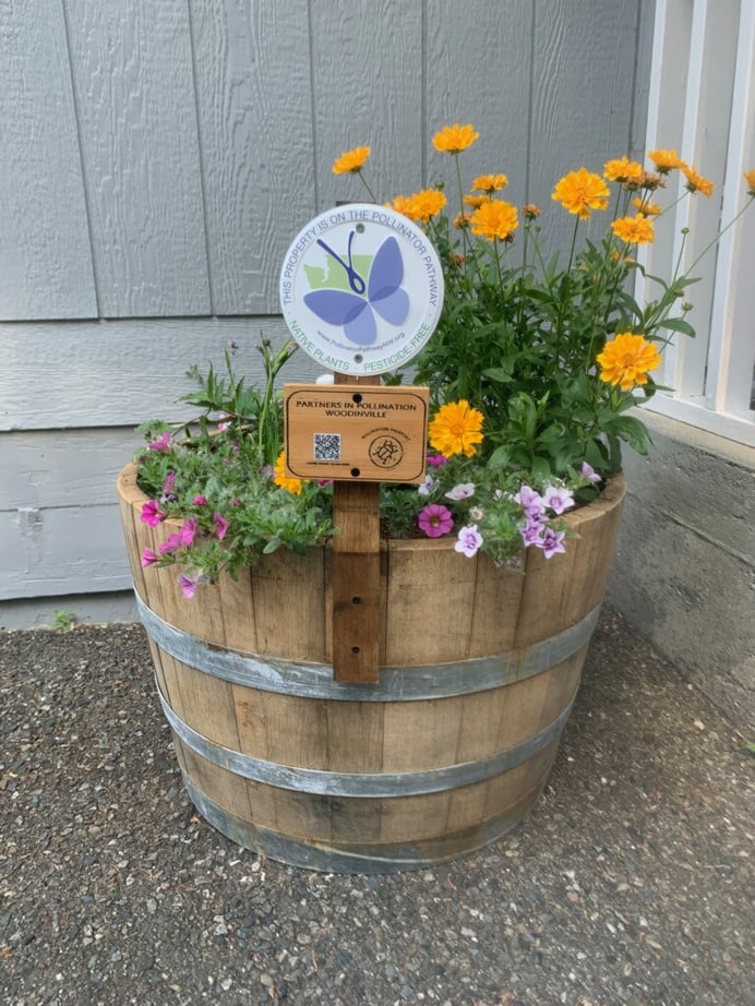 a wooden barrel with flowers 