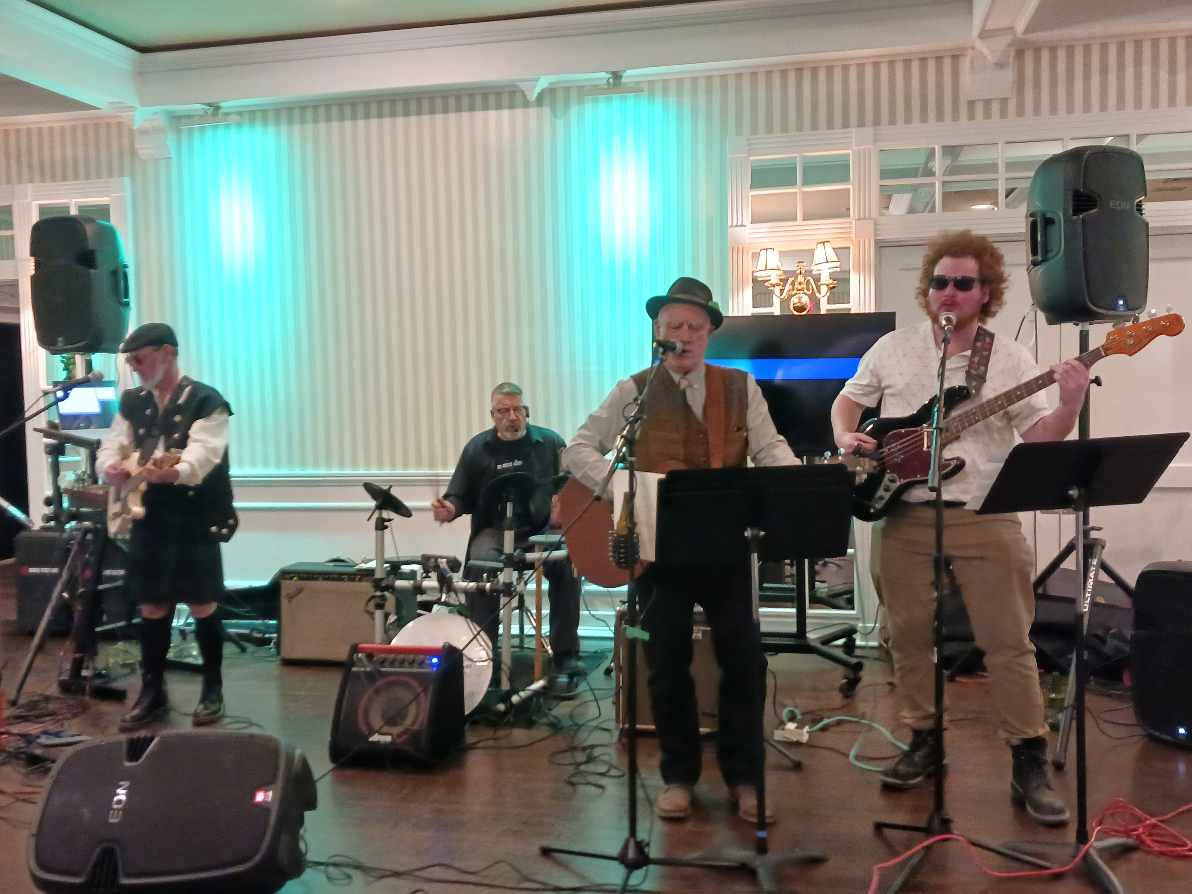 a group of people playing music in a room