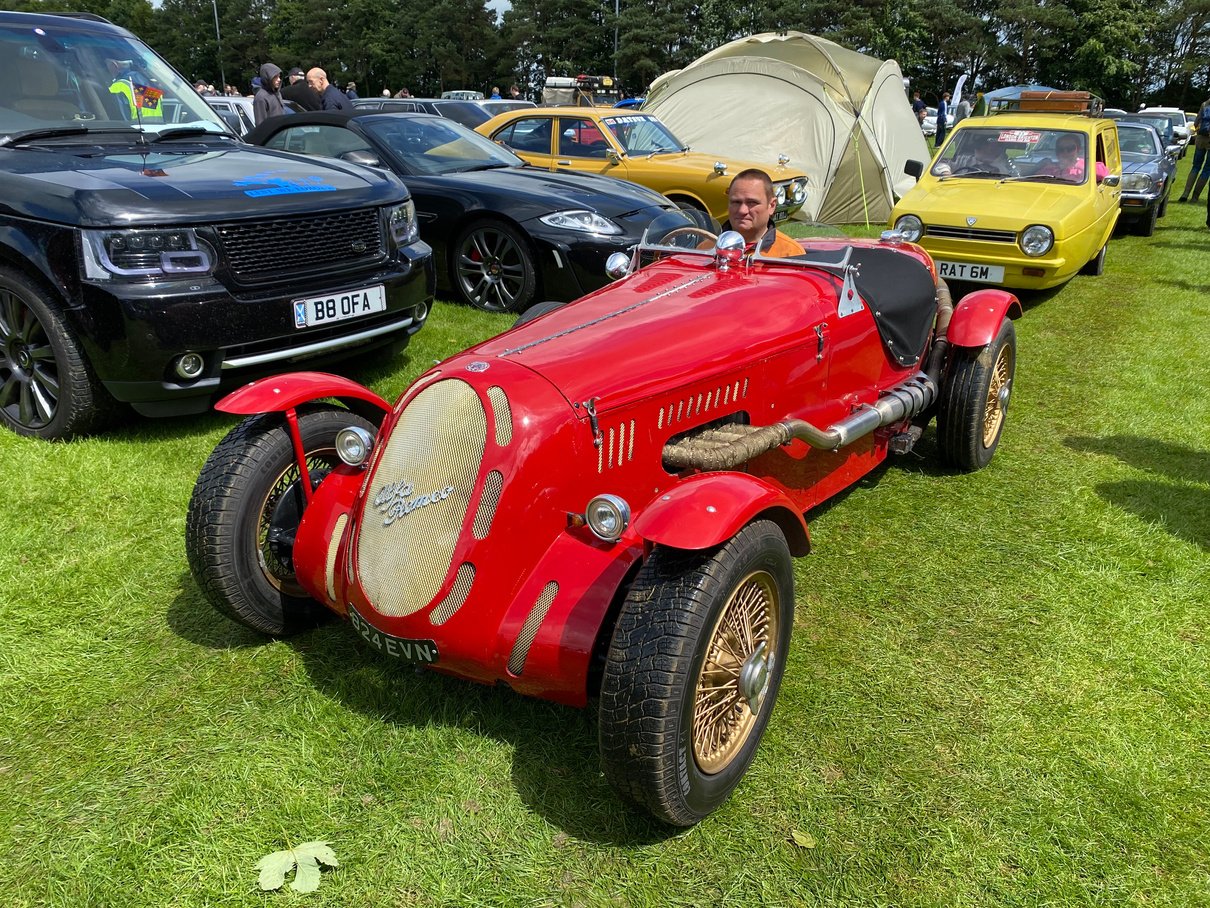 an antique car is on display at a car show