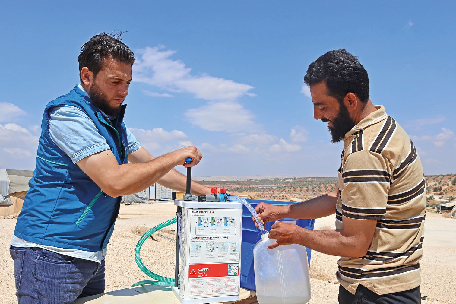 a man demonstrates a water purification filter system