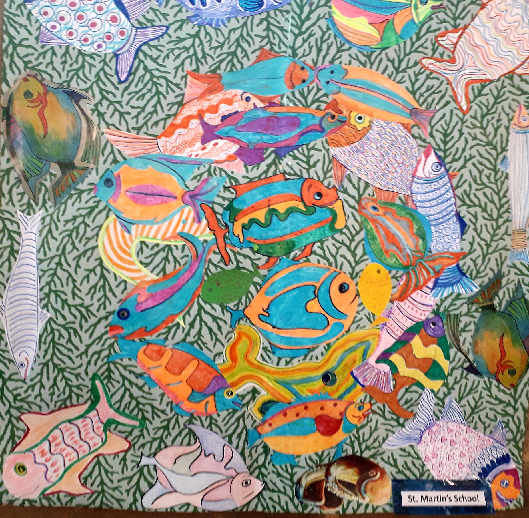 paper collage showing colourful fish underwater